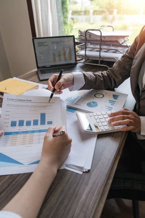 Close up of business team analysis and calculate chart and graph showing change and growth on the finance and marketingの写真素材
