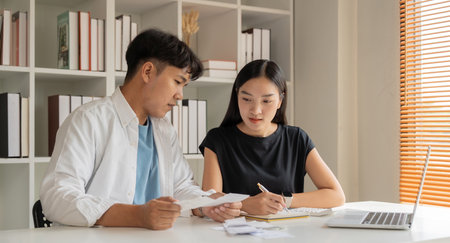 Asian couple hand calculate budget or expense by hold bill at home concept of invest, budget...
