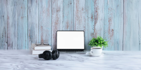Laptop computer mockup blank white screen on table in wood background. Laptop with blank screen on...