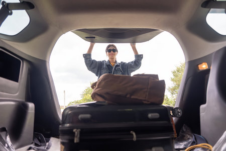 Woman asian travel concept take luggage baggage suitcase and other stuff and belonging from the back...