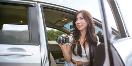 Woman enjoying autumn mountain road trip. concept travelling drive restの写真素材