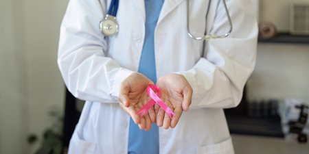 Pink October Breast Cancer Awareness month, doctor with pink ribbon symbol. National cancer survivors month. health care conceptの写真素材