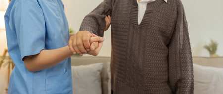 Support, trust and help from caregiver or nurse that helps support walking senior man or patient in home with healthcare insuranceの写真素材