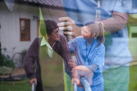 Double exposure physical therapist caregiver talking to senior man using a walker at home. concept home healthcare nurse, physical therapy with senior adult at homeの写真素材