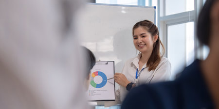 Business woman whiteboard presentation statistics business woman explain finance sales data, research summary or information. Meeting, or report to business teamの写真素材