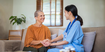 Empathy, trust and nurse caregiver holding hands with patient. consulting support and healthcare advice. Kindness, counseling and medical therapy in nursing home for hope, consultation and psychologyの写真素材