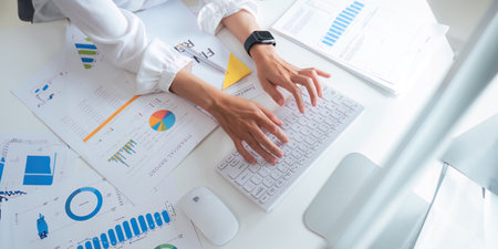 Asian business analyze the situation on the financial report in the meeting room. Investment...