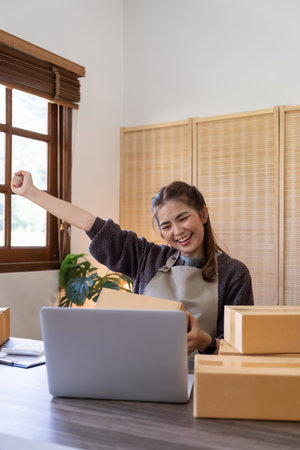 Asian women are achievement success with sale growth. Happy women selling product online with...