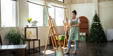 Talented Female Artist Working on a artist lifestyle. painting hobby. woman drawing beautiful watercolor designの写真素材