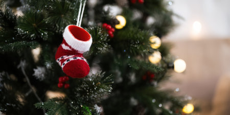Background Christmas Tree and Stockings with Decorations Near a Fireplace with Lights