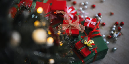 Background Christmas Tree and gift box with Decorations Near a Fireplace with Lightsの写真素材
