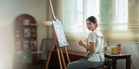 Talented Female Artist Working on a artist lifestyle. painting hobby. woman drawing beautiful watercolor designの写真素材