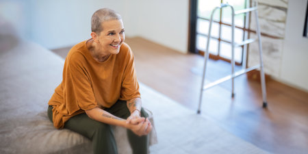 Portrait of happy smile senior woman Caucasian while sitting on the sofa at homeの写真素材