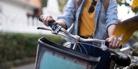 Tourist female asian at street with bike cycle on city roadの写真素材