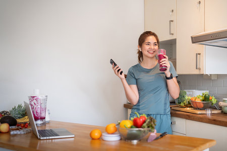 Portrait of beauty body slim healthy asian woman drinking glass of juice. young woman prepare cooking healthy drink in kitchen at home. Diet concept. healthy drinkの写真素材