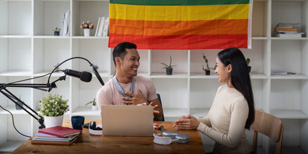 Joyful Asian gay man with Girl friend record podcast from studio. Radio, podcasts and blogging conceptの写真素材