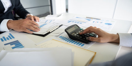 Business team analyzing income chart and graph in office. Close up. Business analysis and strategy conceptの写真素材