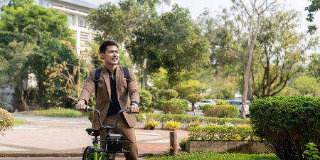 The businessman eco friendly transportation, cycling through the city avenues to go to work....