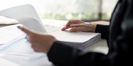 Documents, Business woman and accountant reading report for information, financial data or analysis....