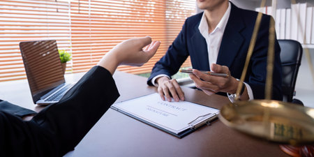 Professional Lawyer Signing Business Contract in Office Setting with Client, Legal Consultation,...