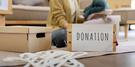 Volunteer Collecting and Donation Clothes for Charity. Community Service and Generosity in Actionの写真素材