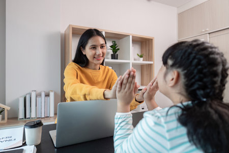 Mother and Child Working from Home, Engaging in Fun Activities, Modern Home Office Setting