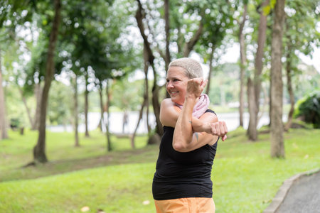 Active Senior Stretching Muscles for Fitness and Flexibility in Outdoor Exercise Routine