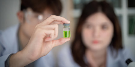 Laboratory Scientist Examining Green Sample for Chemical Analysis - Concept of Scientific Innovation...