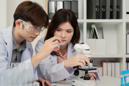 Science Researchers Conducting Microscope Experiments - Concept of Collaborative Scientific...