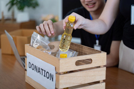 Volunteers Sorting Donations for Community Service Initiativeの写真素材