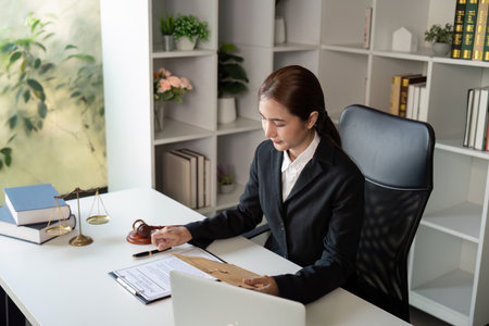 Dedicated Lawyer Reviewing Case Materials in Officeの写真素材