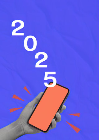2025 Vision Represented by Smartphone in Hand against Blue Backdropの写真素材