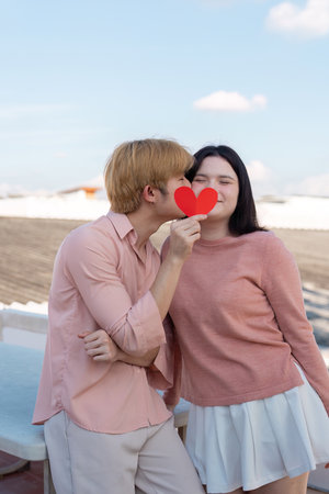 Valentine day celebration for a couple on a rooftop romantic moment outdoor setting joyful atmosphereの写真素材