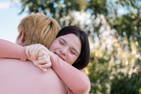 Couple embracing on valentine day in nature emotional connection outdoor setting warm vibesの写真素材