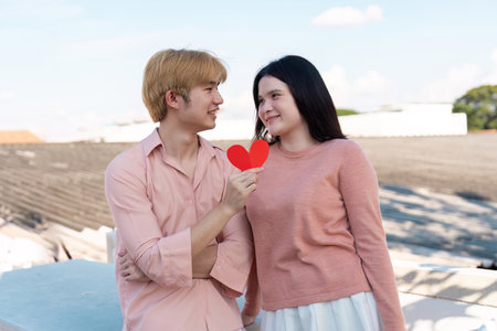 Valentine couple sharing love in urban setting romantic moment daytime joyful connectionの写真素材
