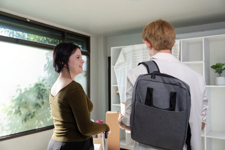 Family couple moving house a new beginning in their new home warm environment indoor viewpoint