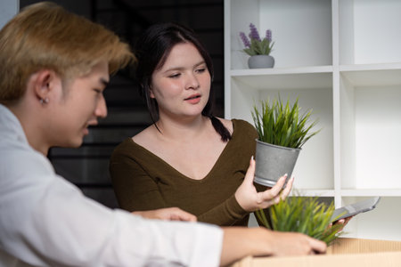 Family couple moving house together home setting lifestyle content indoor environment personal viewpointの写真素材