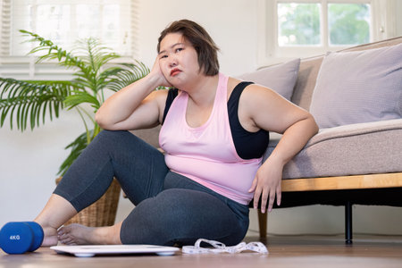 Overcoming weight challenges a personal journey in lifestyle transformation at home focusing on fat and overweight realitiesの写真素材