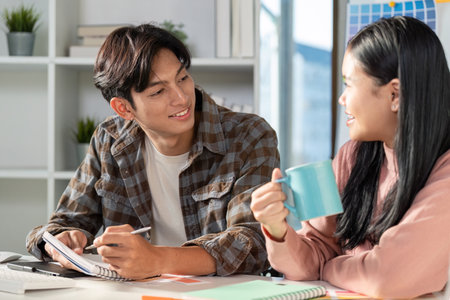 Team meeting on graphic design strategies with color charts in a modern office environmentの写真素材