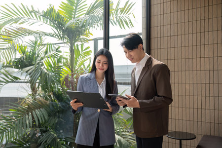 Businesswoman organizing thoughts, smiling and engaged in teamwork.