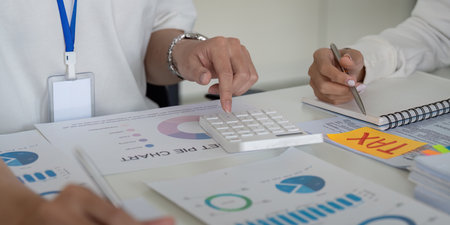 Using a calculator for financial analysis and tax preparation