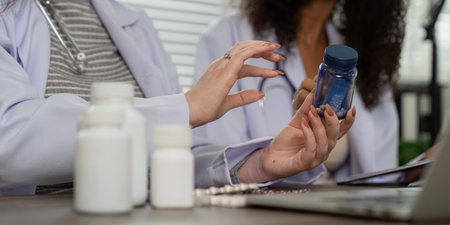 Telemedicine and Medication Review. A medical professional showcasing pharmaceutical options during...