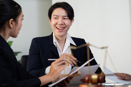 Client Consultation and Legal Support. A lawyer engaging in a candid discussion with clients.の写真素材