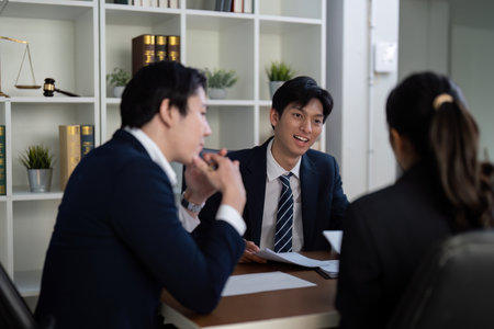 Engagement and Legal Strategy. Lawyers collaborating on a case discussion.の写真素材