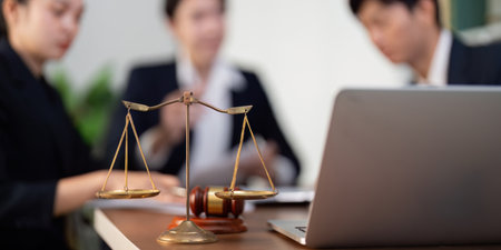 Justice and Balance. Symbolic scales of justice in a professional legal meeting.の写真素材
