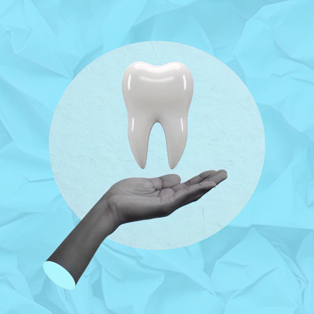 Dental Health and Wellness. A large tooth is held gently in hand, symbolizing care and awareness in oral hygiene.の写真素材