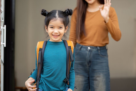 Smile and Anticipation for School. A girl smiling brightly as she prepares to leave for school.の写真素材