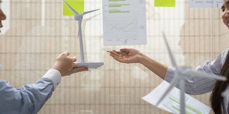 Renewable Energy Collaboration. Professionals discussing wind energy projects and sustainability...