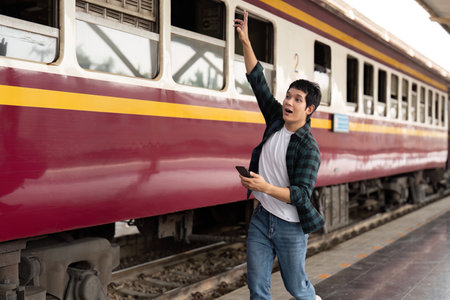 Excitement and Departure. A young man hurrying to catch his train.