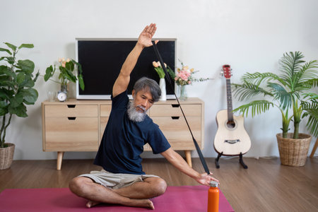 Wellness exercises for elderly man stretching at home
